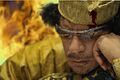 Muammar Gaddafi plays chess in hell.jpg